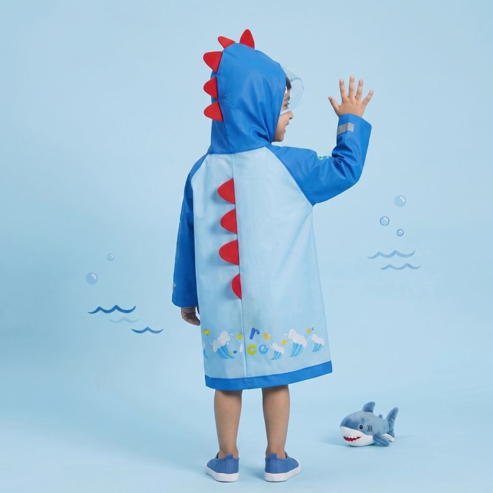 Back view of blue boys raincoat with dinosaur spikes and wave print