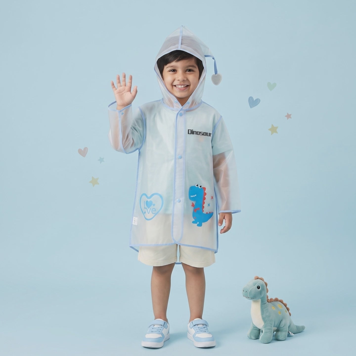 Boy wearing transparent blue kids raincoat with dinosaur print